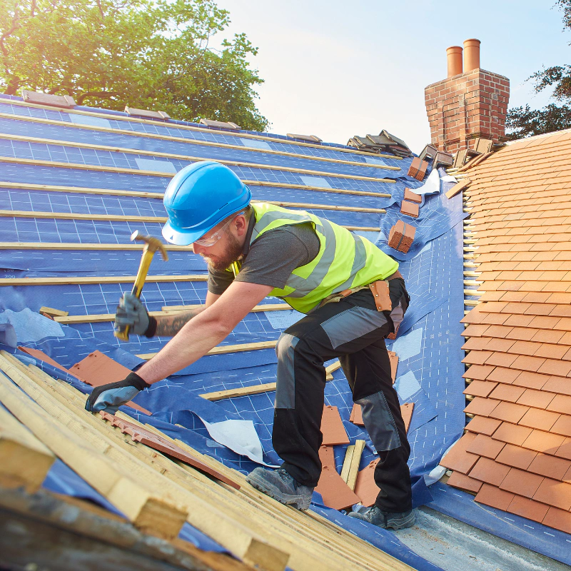 a person installing new roof tiles